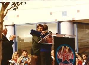 Leonard hugging De at De's star ceremony
